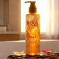U&I Oud bath and shower gel in a 200ml amber bottle, displayed on a wooden log with flower petals in a warm setting.