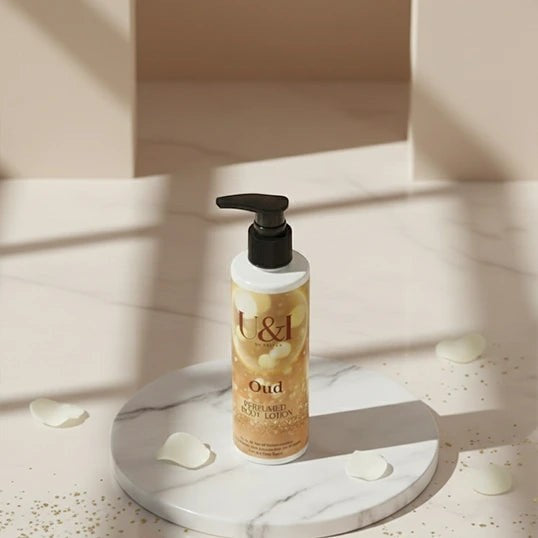 U&I Oud perfumed body lotion in a 200ml pump bottle, displayed on a marble pedestal with scattered white petals.