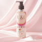 U&I Salt N Silk bath and shower gel in a 200ml pump bottle, set against a soft, draped pink satin background.