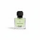 U&I Breeze of Eden perfume in a clear glass bottle with a textured black cap and light green garden-inspired liquid.