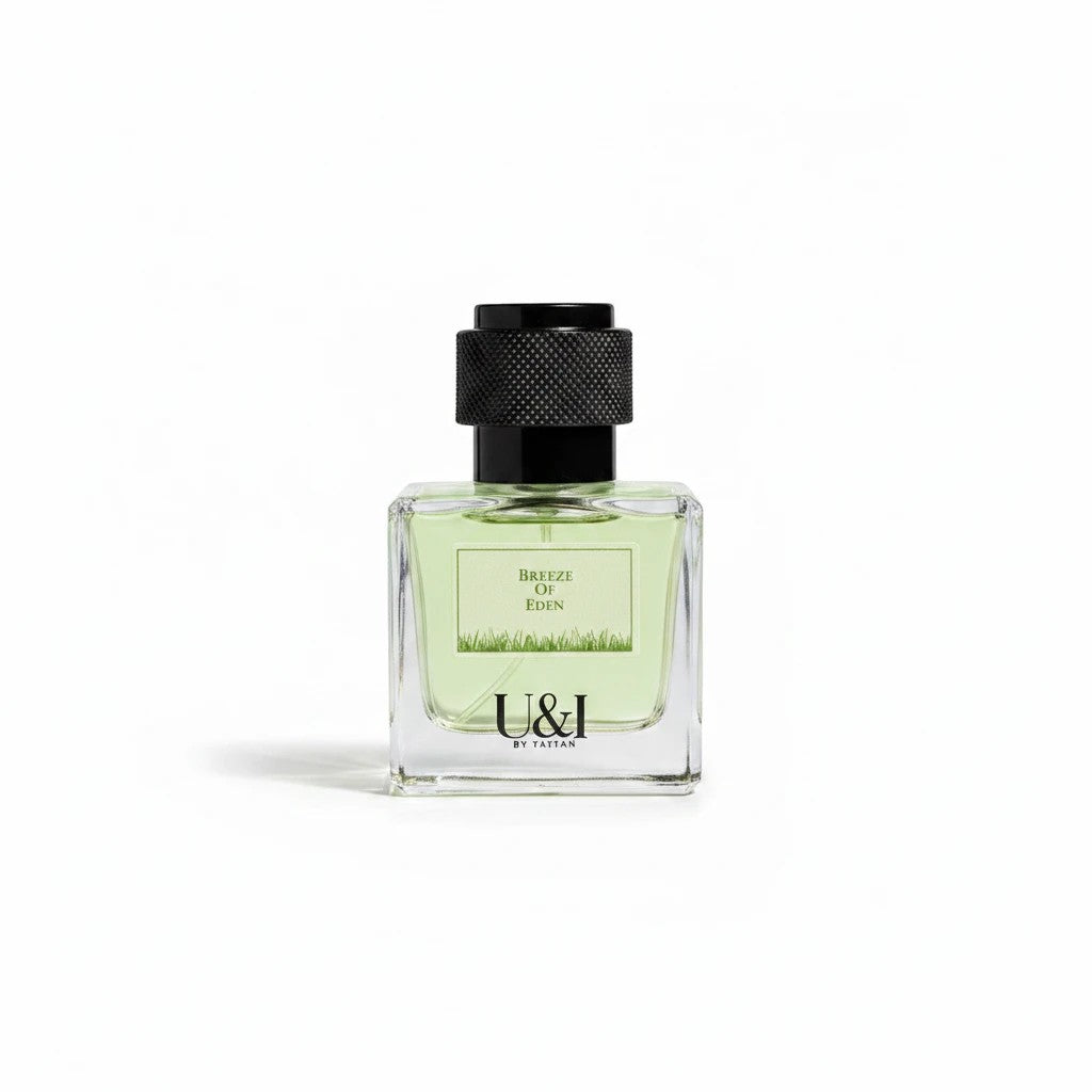 U&I Breeze of Eden perfume in a clear glass bottle with a textured black cap and light green garden-inspired liquid.