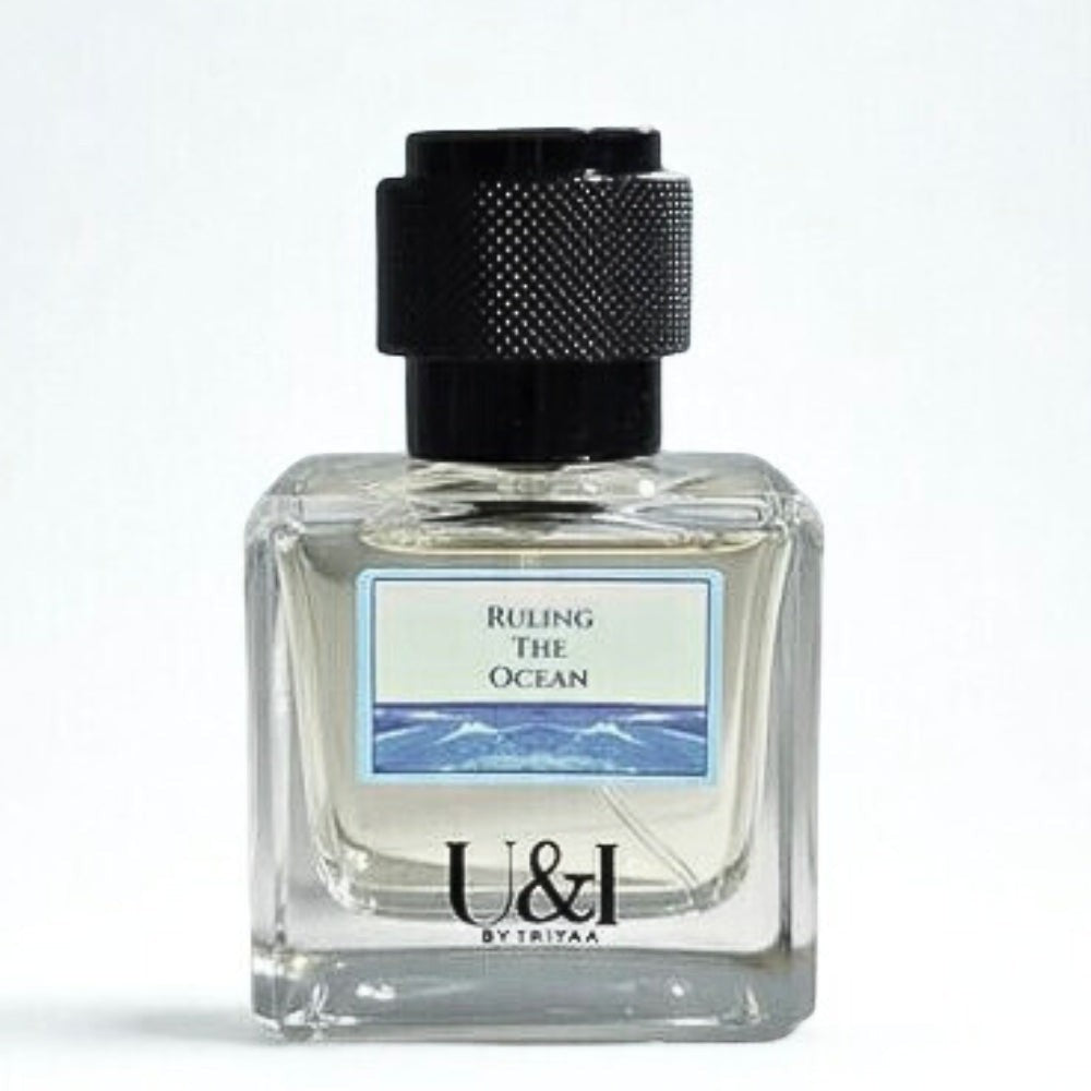 U&I Ruling the Ocean fragrance bottle with a clear glass design and textured black cap against a white background.